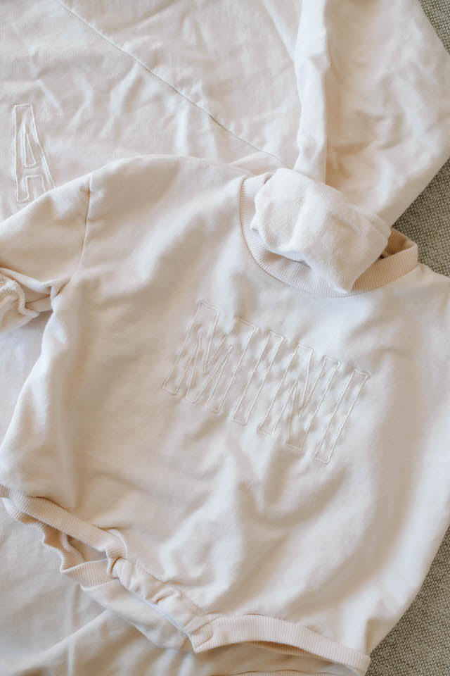 BABY EMBROIDERED 'MINI' SWEATER ONESIE - COCONUT